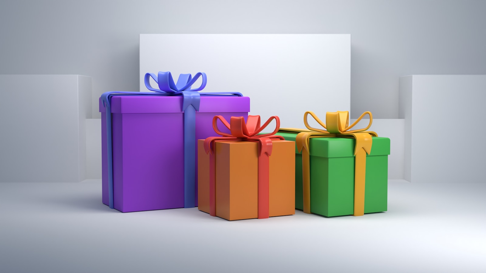 un gruppo di tre scatole regalo colorate con nastri